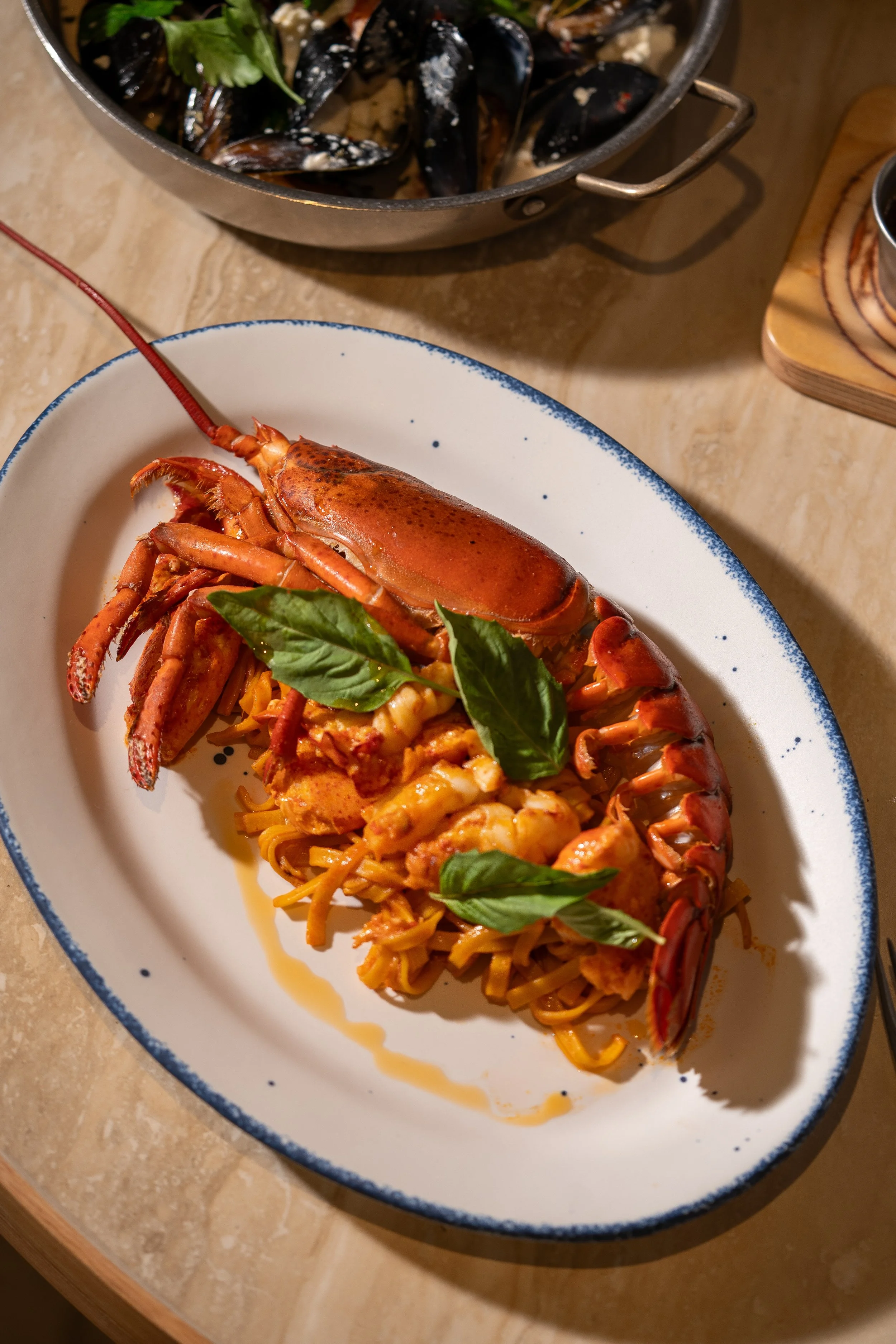 Athenian lobster pasta, handmade linguine, cherry tomato sauce, basil