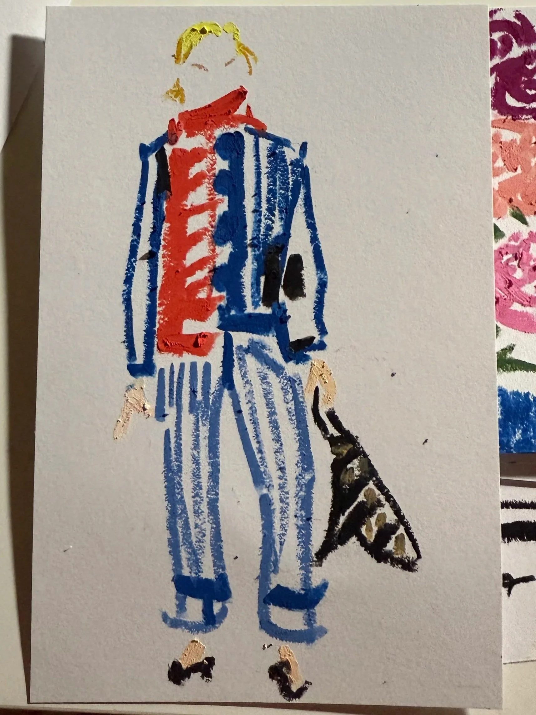 Watercolor painting of a woman holding a black and tan dog. The woman has blonde hair and is wearing a red scarf and a blue striped coat and pants.