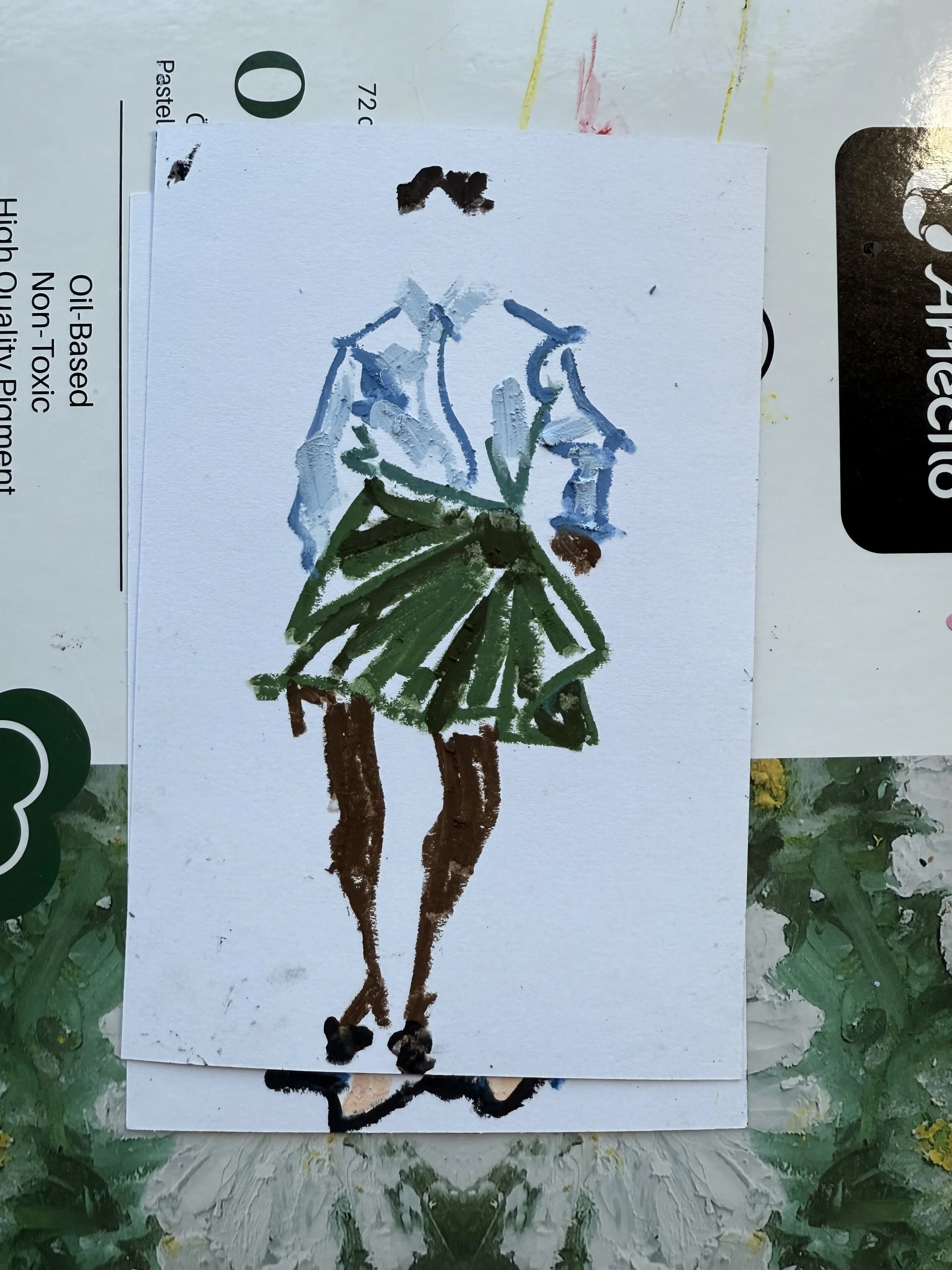 Painting of a girl in a green dress with brown shoes, blue top, and black hair, standing with hands on hips, created with thick brushstrokes.