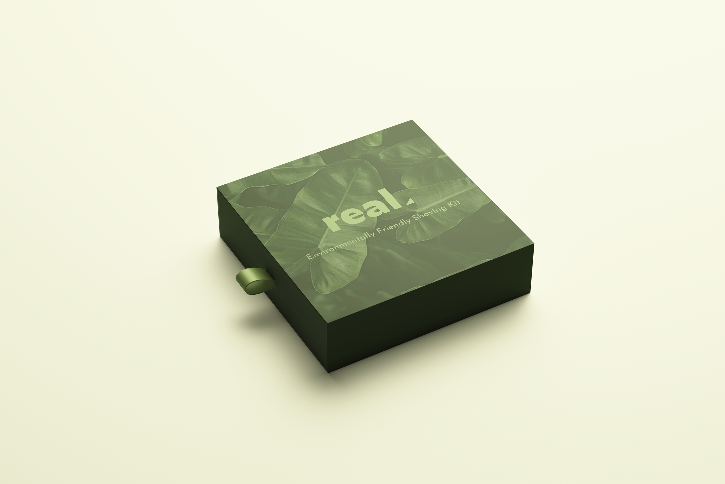 A green and black box labeled 'real' with a picture of leaves and the text 'Environmentally Friendly Shaving Kit' on a light-colored background.