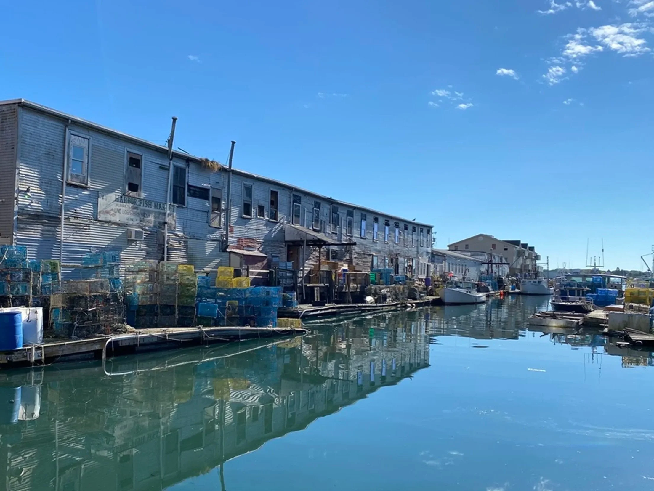 Custom House Wharf Harbor Reflections - Portland, ME

Calm harbor water reflects the historic wharf buildings, fishing boats, and lobster gear that define Portland, Maine’s working waterfront. The quiet channel and mirrored sky create a peaceful mome