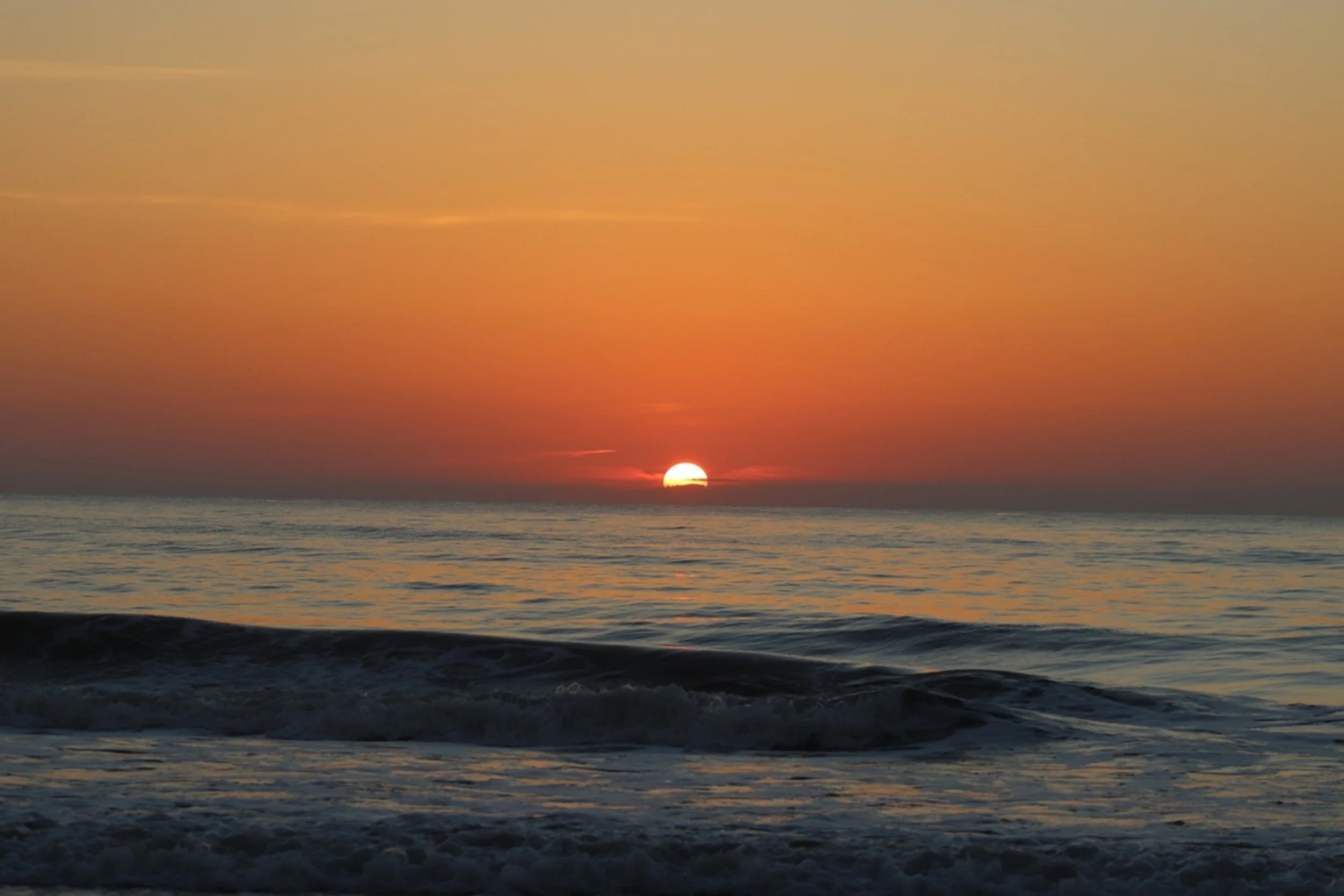 First Rise

The sun begins its ascent above the ocean horizon, casting warm orange light across gentle morning waves. This moment marks the quiet transition from night to day along a peaceful coastal shoreline.

Best Hospitality Placement:

Lobby fea