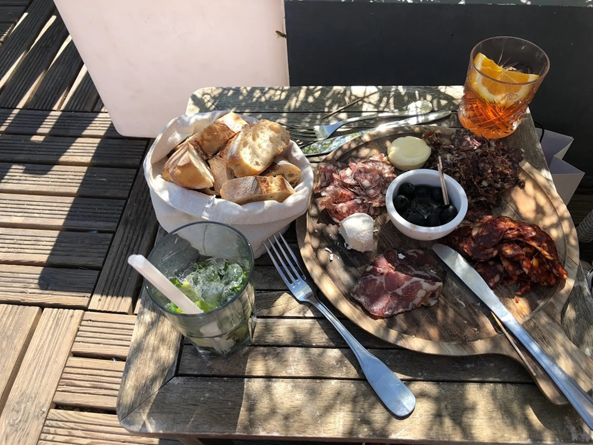 Afternoon Board: A thoughtfully arranged charcuterie board paired with cocktails and warm afternoon light captures the essence of relaxed hospitality and shared experiences. Rich textures, artisan ingredients, and an inviting outdoor setting make thi