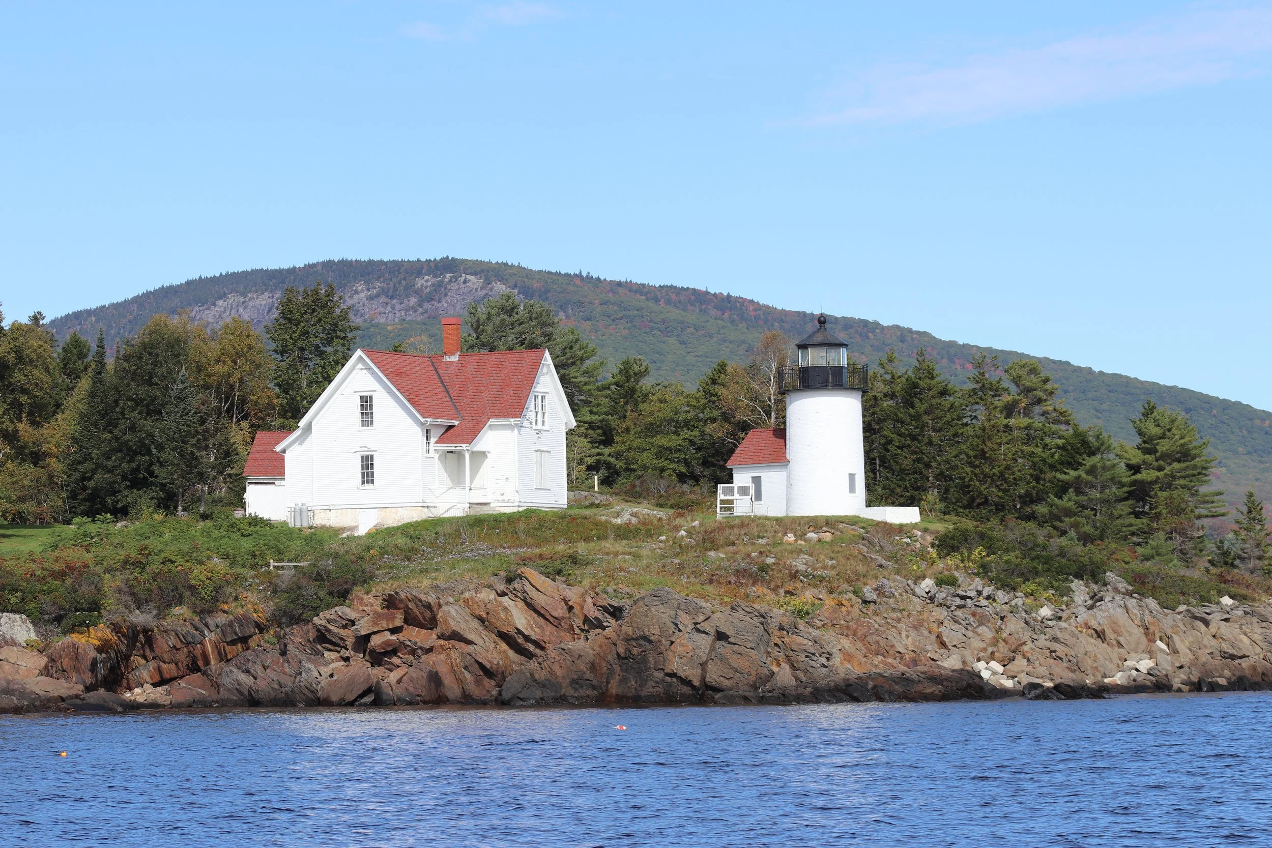 Bass Harbor Lighthouse: Perched on Maine's rugged granite shoreline, Bass Harbor Lighthouse stands as a timeless symbol of guidance, resilience, and coastal heritage. The contrast between weathered rock, classic New England architecture, and tranquil