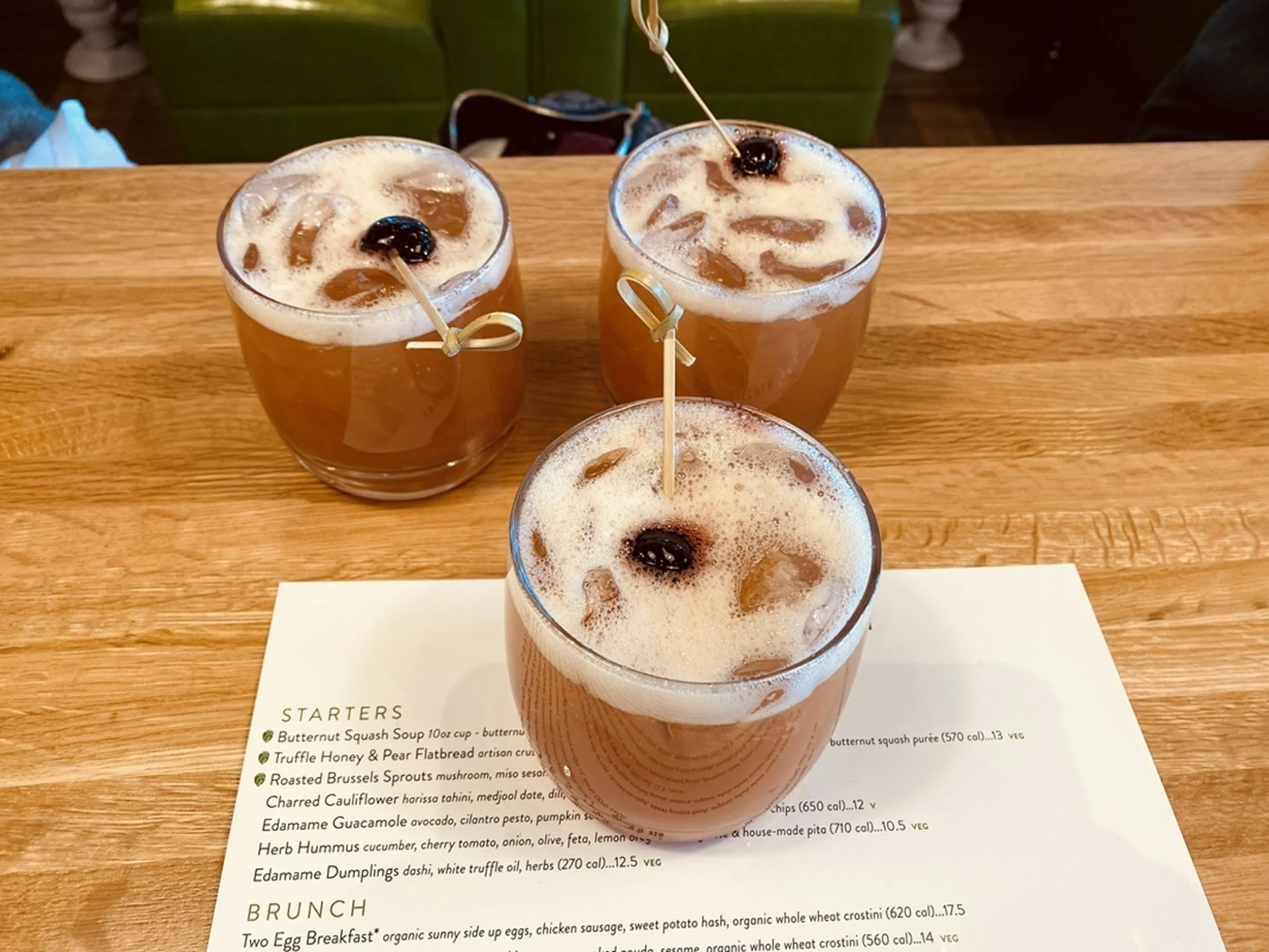 Cheers, Together!

Three cocktails rest atop a menu, ice catching light while citrus and cherries add detail—a moment of shared indulgence captured from above.

Best Use:

Brunch venue
Social lobby bar
Hospitality meeting space

Feels modern and soci