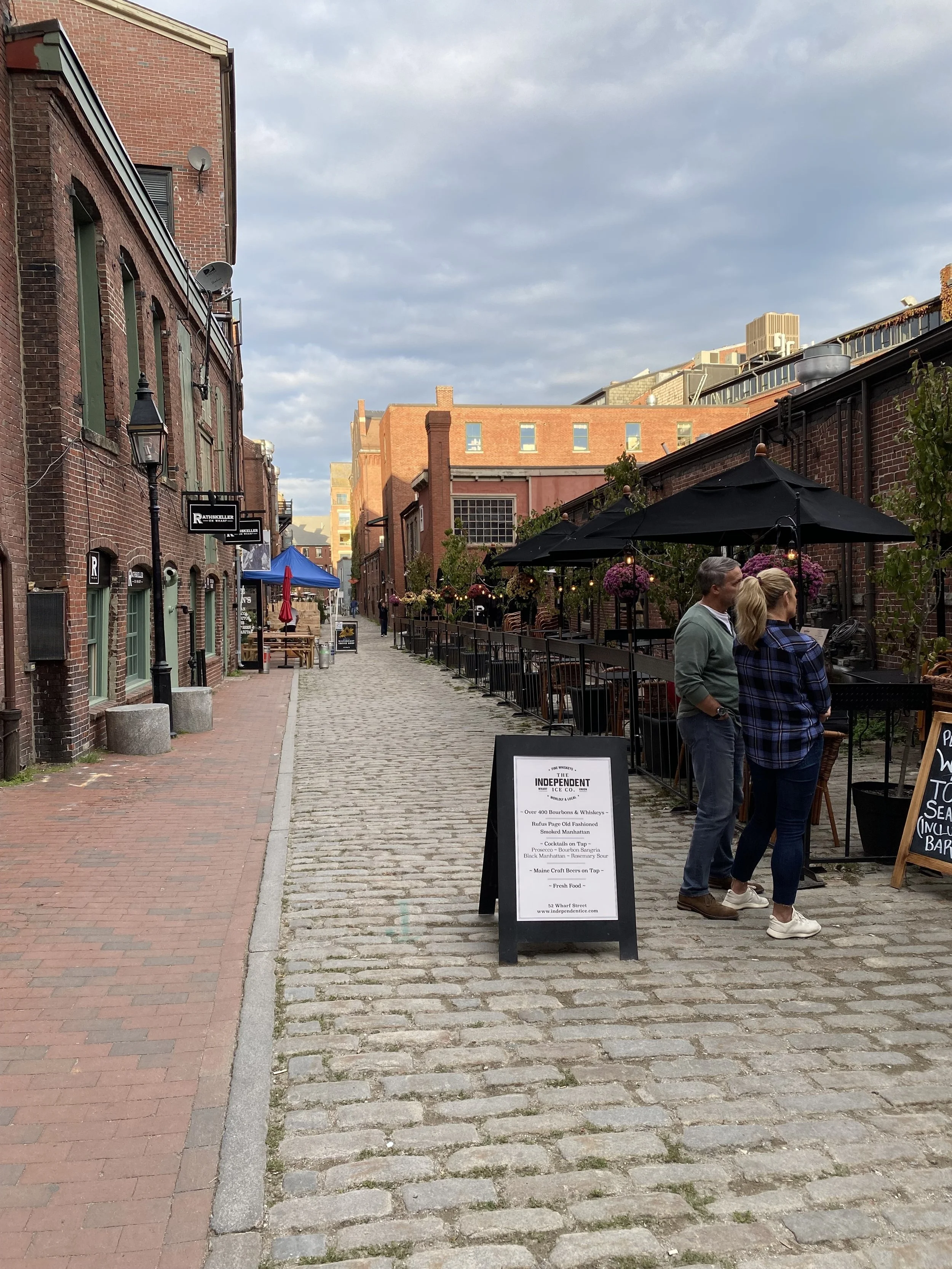 Cobblestone Conversations

Outdoor dining spills onto a cobblestone street as guests pause to talk beneath umbrellas and historic brick facades. The scene reflects the social heartbeat of a vibrant urban neighborhood.

Best Hospitality Placement

Res