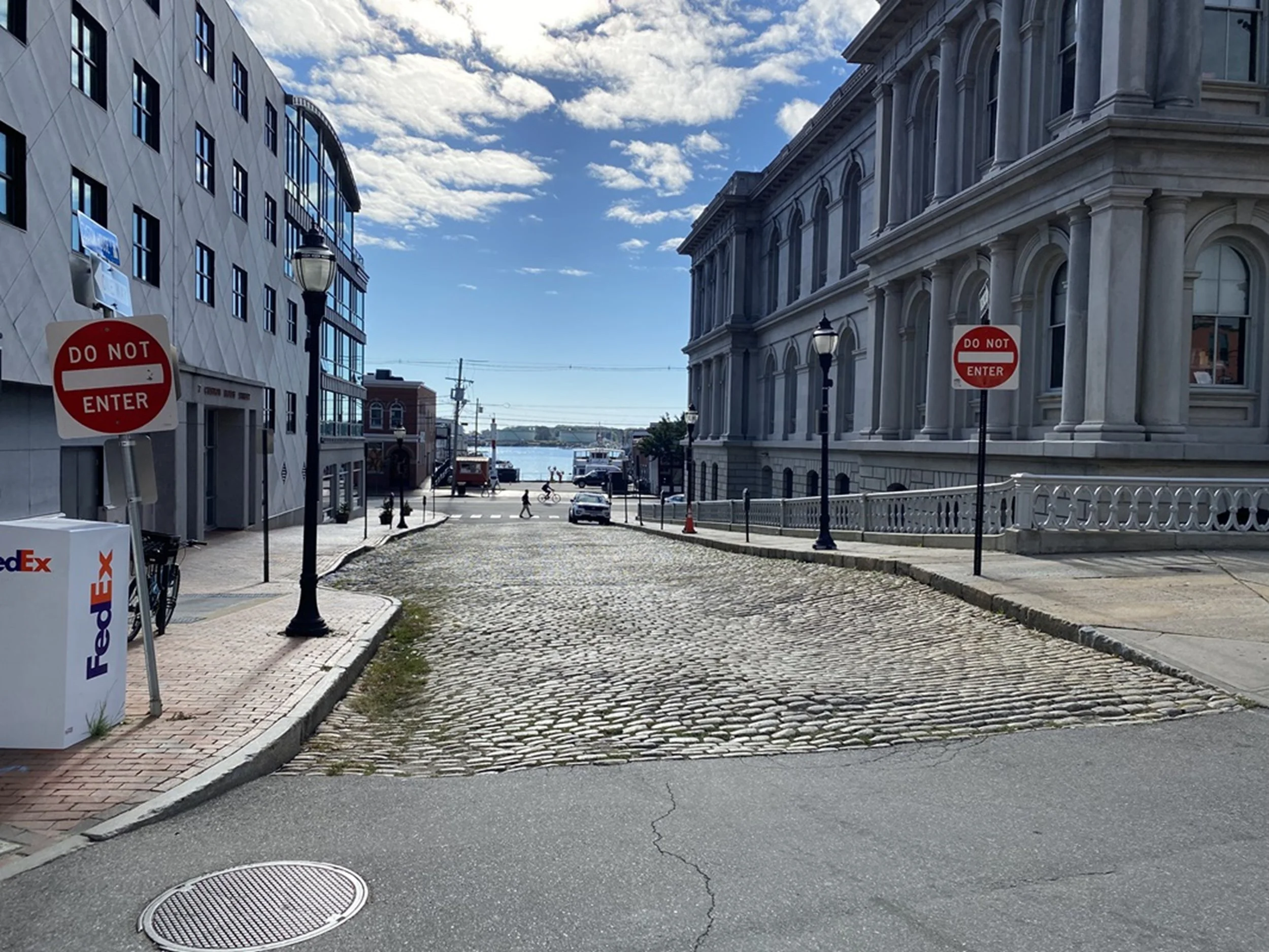 Road to the Water - Portland (ME)

A gently sloping cobblestone street draws the eye toward the harbor beyond, framed by historic buildings and open sky. The composition captures anticipation and movement—an invitation toward the water and the life t