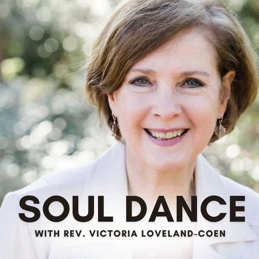 Close-up portrait of a smiling woman with short brown hair, wearing earrings and a white outfit, outdoors with blurred greenery in the background. The text reads "Soul Dance with Rev. Victoria Loveland-Coen."