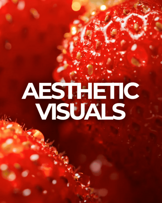 Close-up of strawberries with water droplets, with overlaid text 'Aesthetic Visuals'.