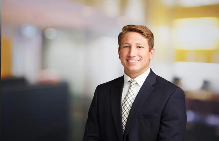 Smiling man in business suit in an office setting