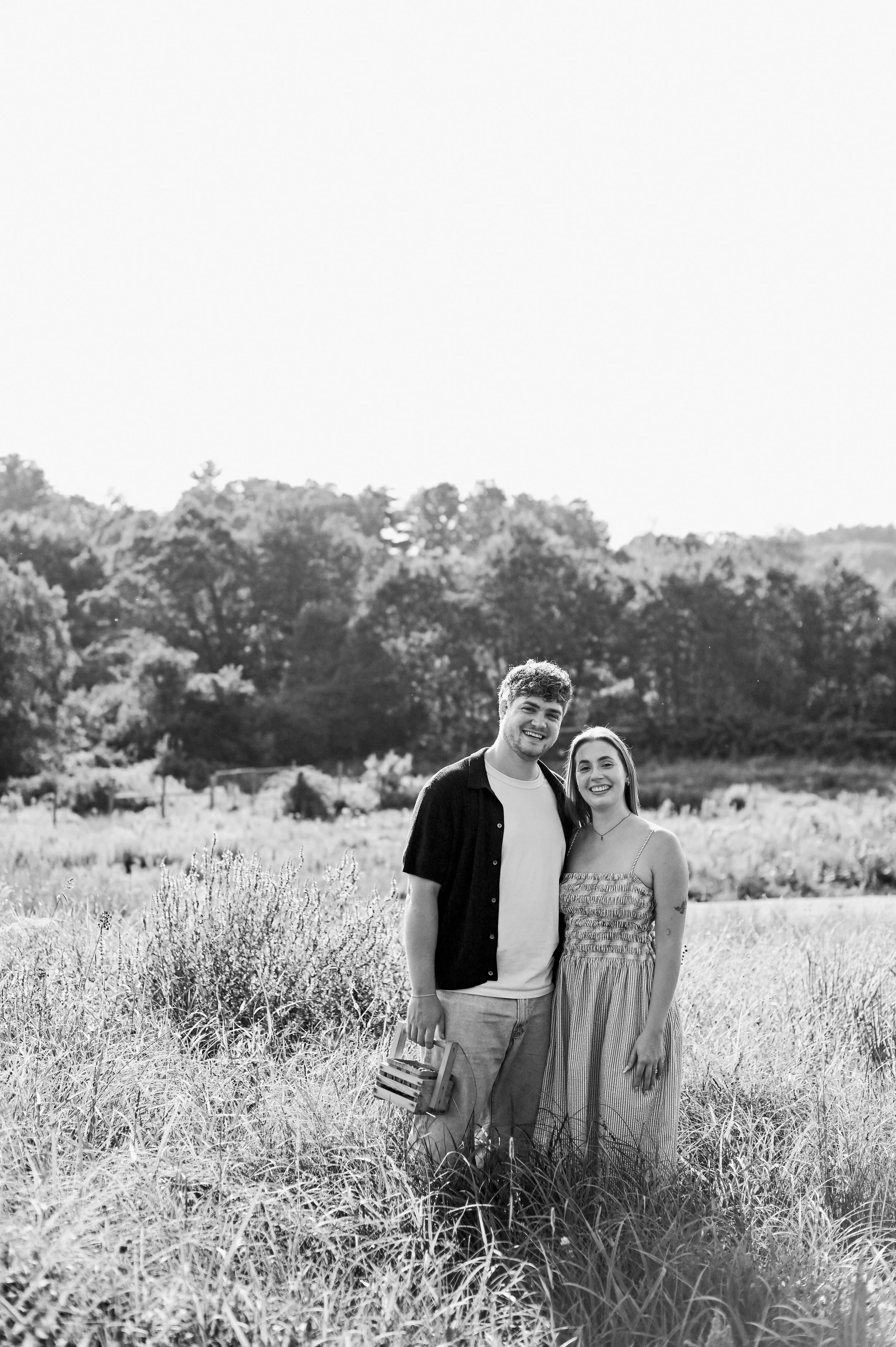black and white photo of a happy couple in a field in Gorham, Maine