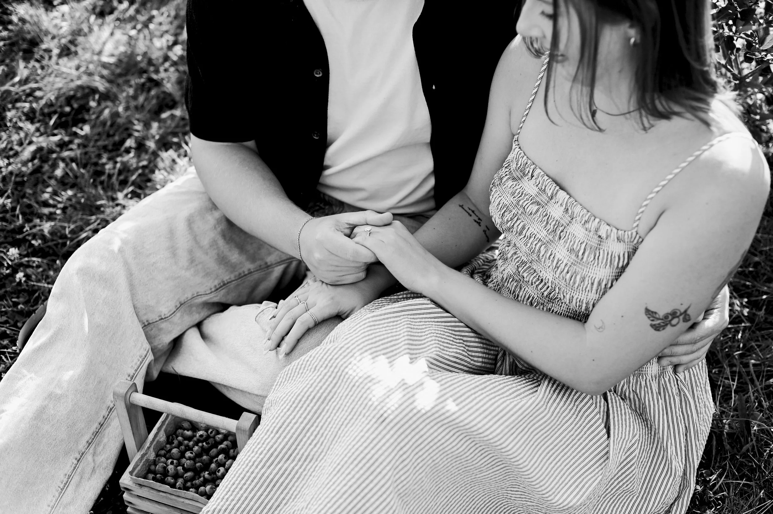 black and white photo of a just engaged couple at a farm in Maine