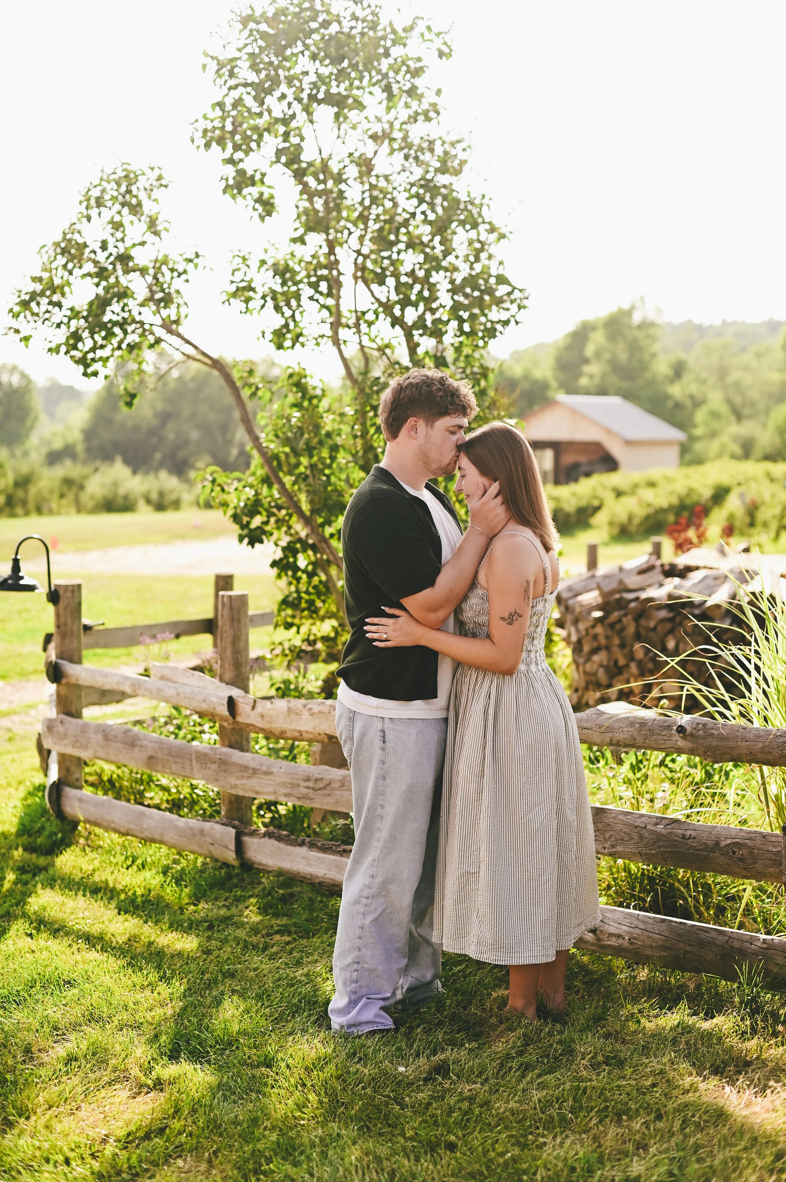 a couple celebrating their engagement at Orchard Ridge Farm in Maine