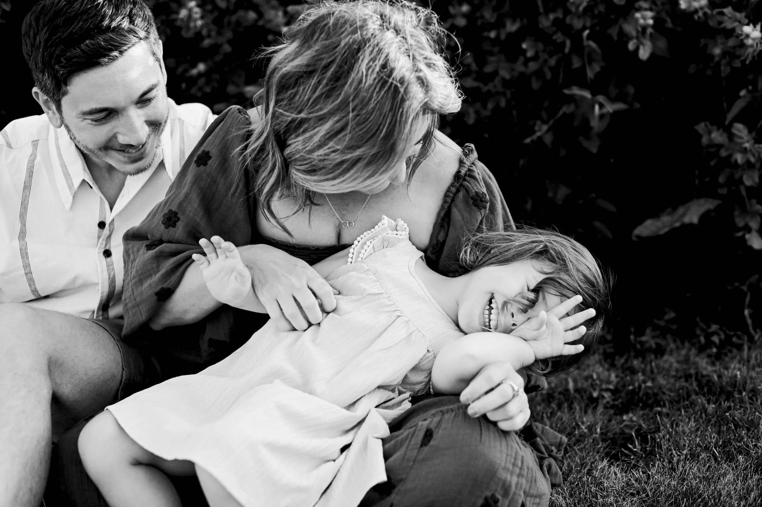 Family candidly cuddling during their Maine family photos