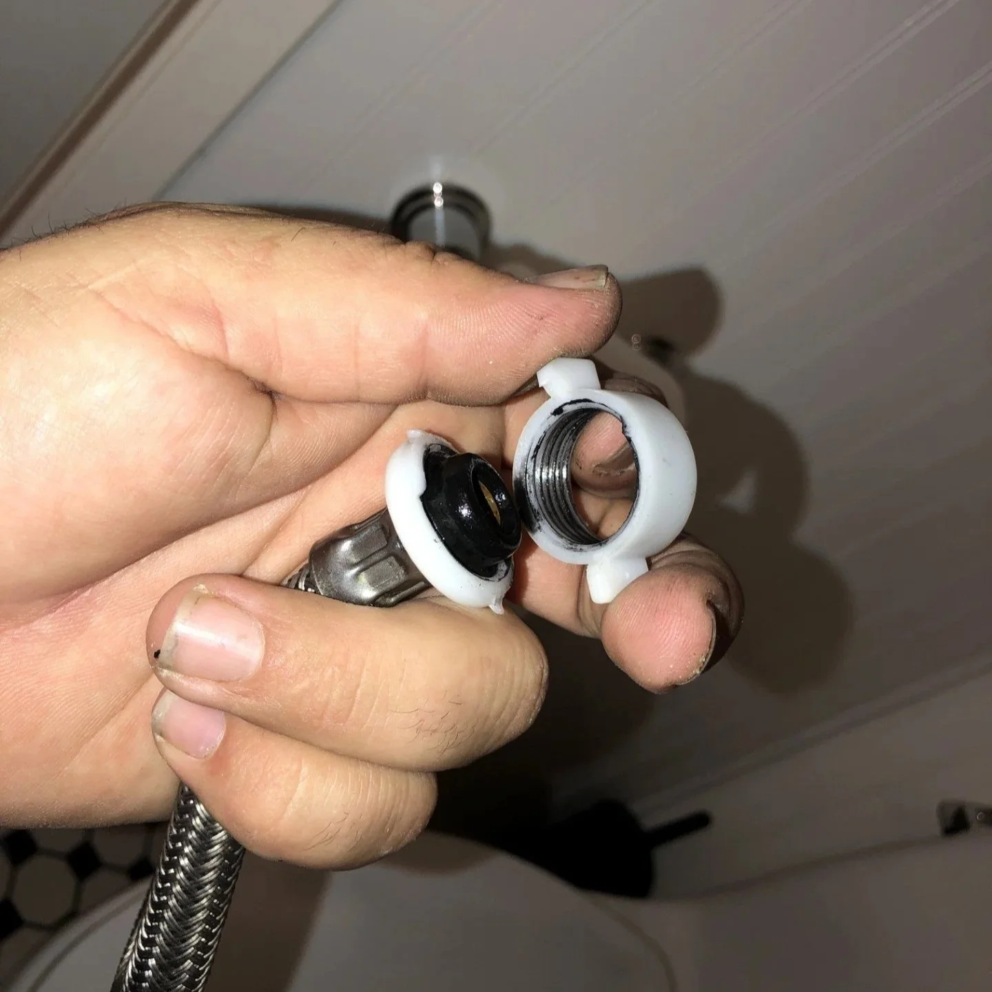 failed toilet water supply line with split coupling nut documented during a cause and origin investigation