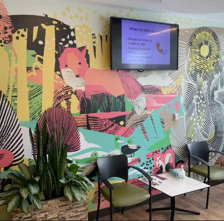 A colourful fox vinyl graphic installed on the wall of a waiting room