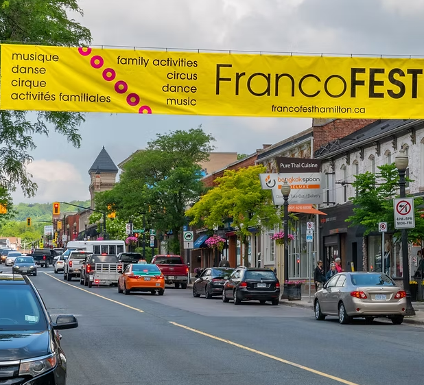 A yellow banner that reads "FrancoFest" and the details of the downtown Hamilton hosted festival