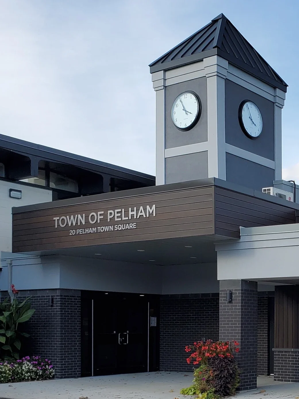 The exterior of the Town of Pelham building displaying the town name and building address
