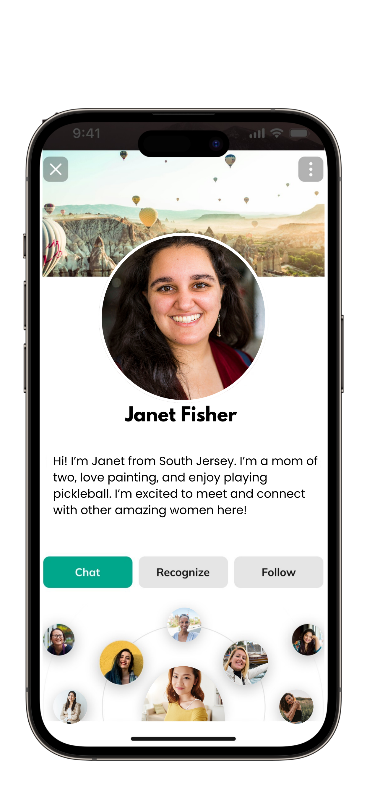 A smartphone screen displaying a dating app profile of Janet Fisher, a woman with dark hair, smiling, with a background of hot air balloons over a scenic landscape. Her profile includes a brief bio and buttons for chatting, recognizing, and following.
