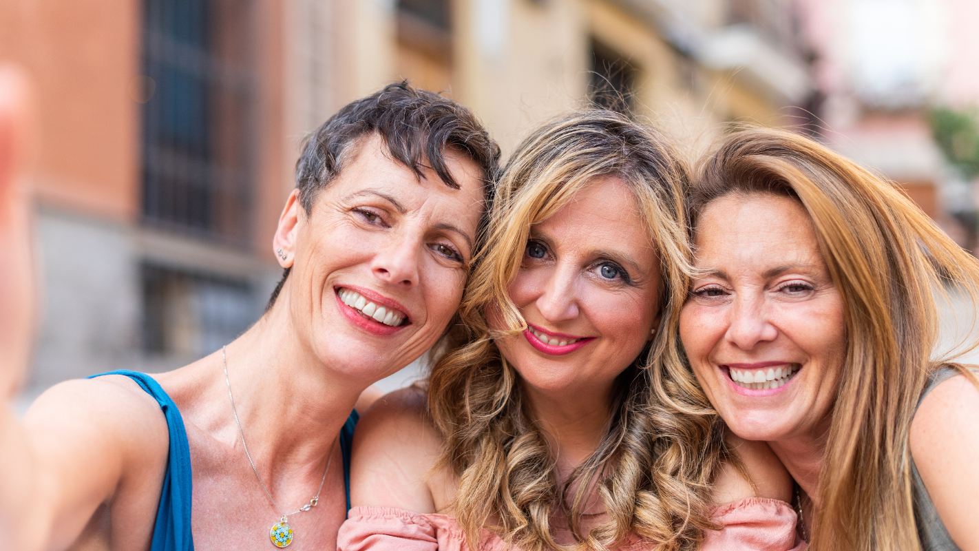 A group of older women taking a selfie