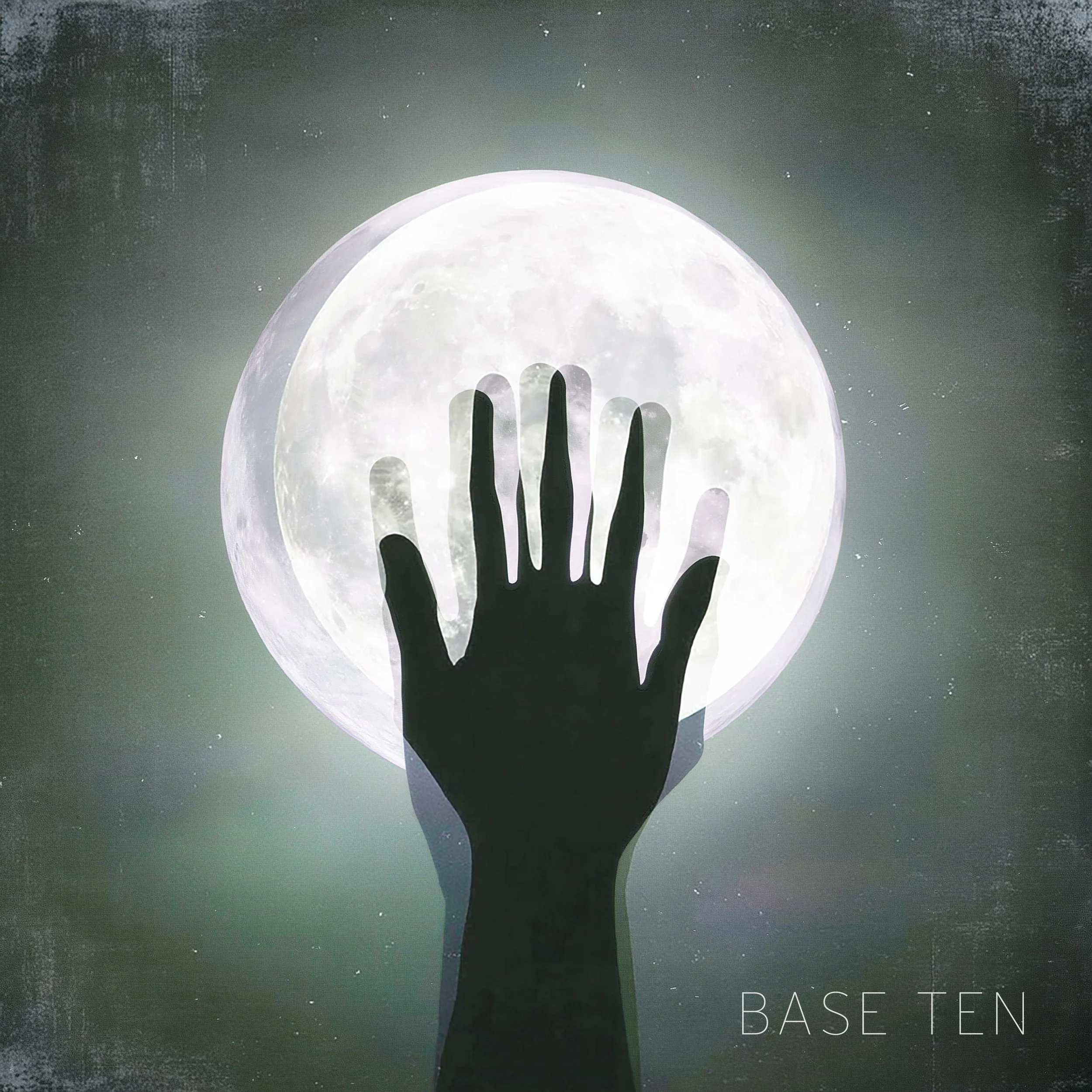 A silhouetted hand reaching towards a full moon, with a dark sky background.