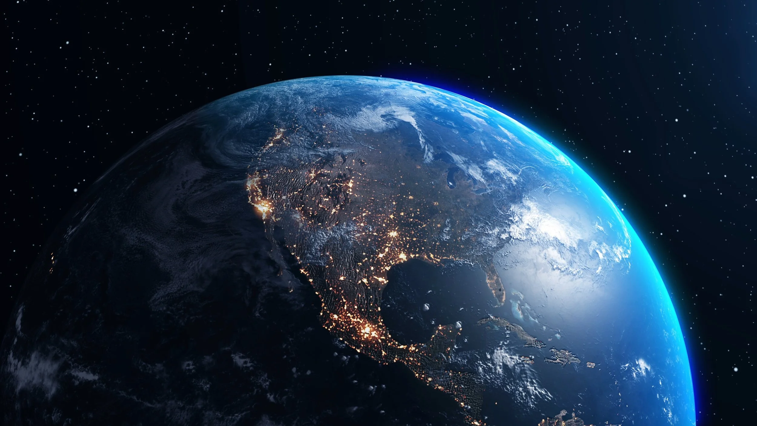 Earth viewed from space during nighttime, showing city lights across North America with a blue glow around the planet's edge.