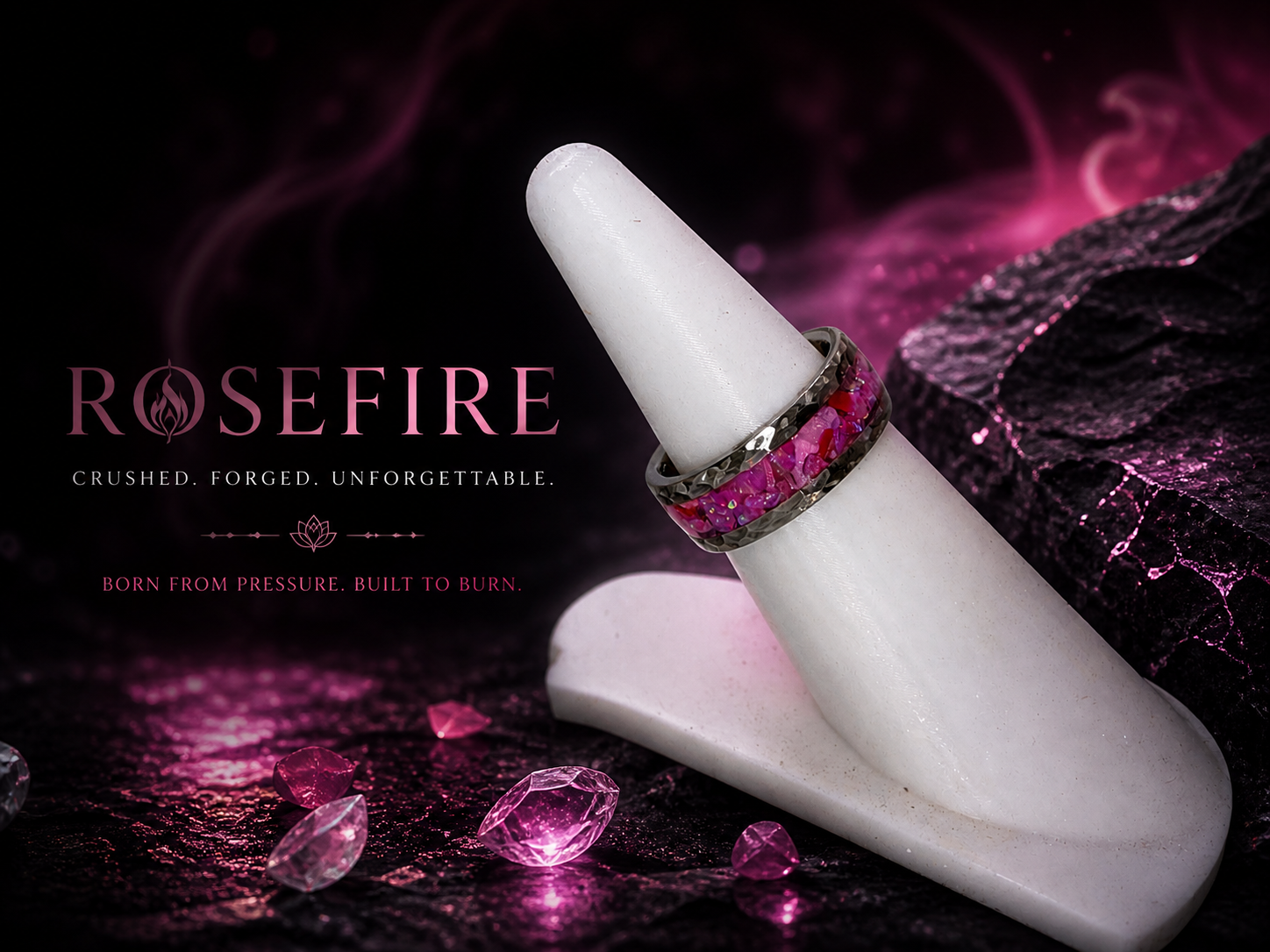 A jewelry advertisement for Rosefire rings, featuring two stacked rings with crushed pink gemstones, displayed on a white ring holder against a dark, textured background with pink and purple accents and scattered pink gemstones.