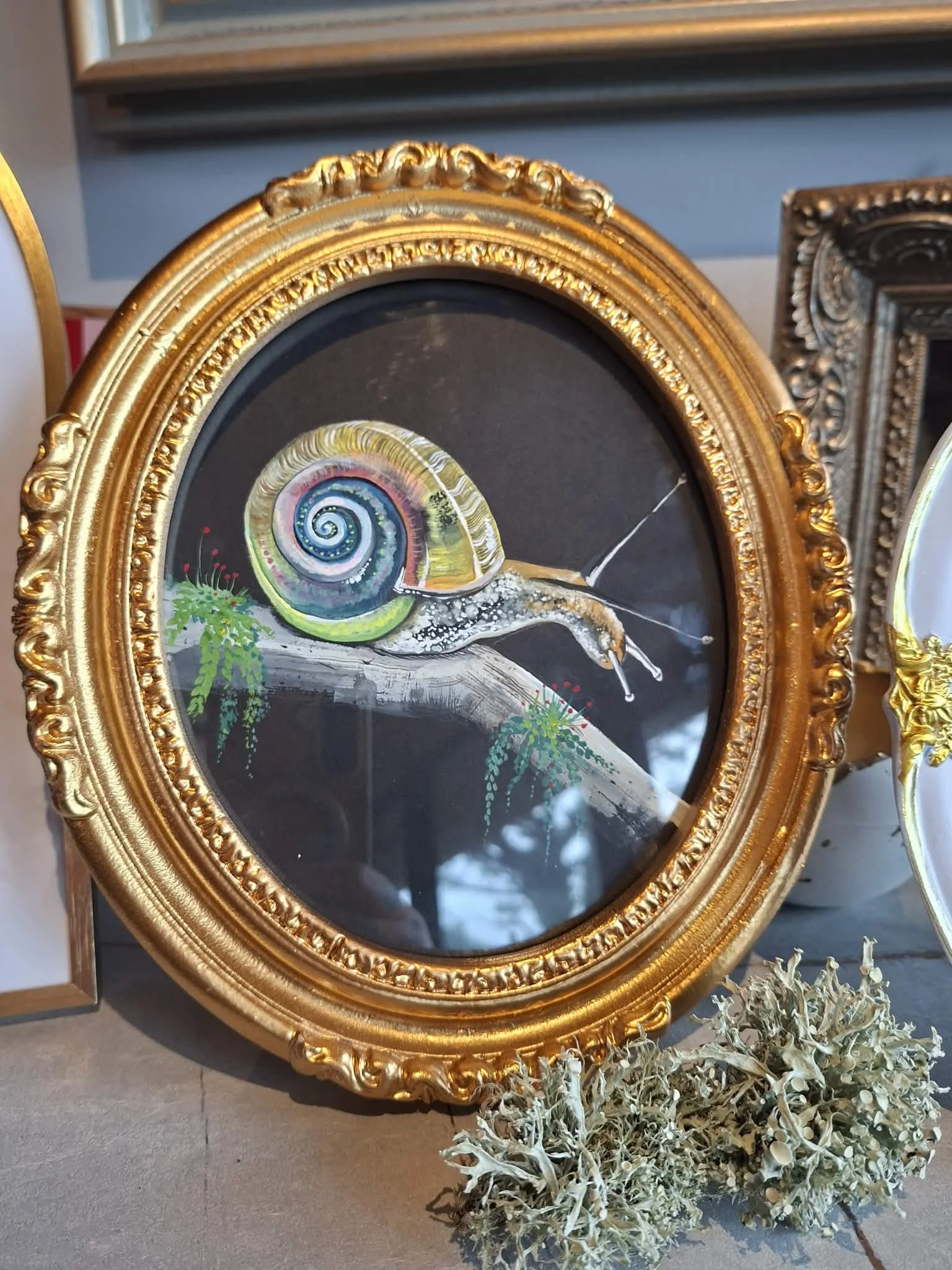 €150 SOLD
“Spiral” 

A small study of a snail in motion, its shell rendered in layered colour that shifts from soft greens to warm golds and violets. The spiral form becomes the focal point both natural structure and quiet symbol of growth and contin