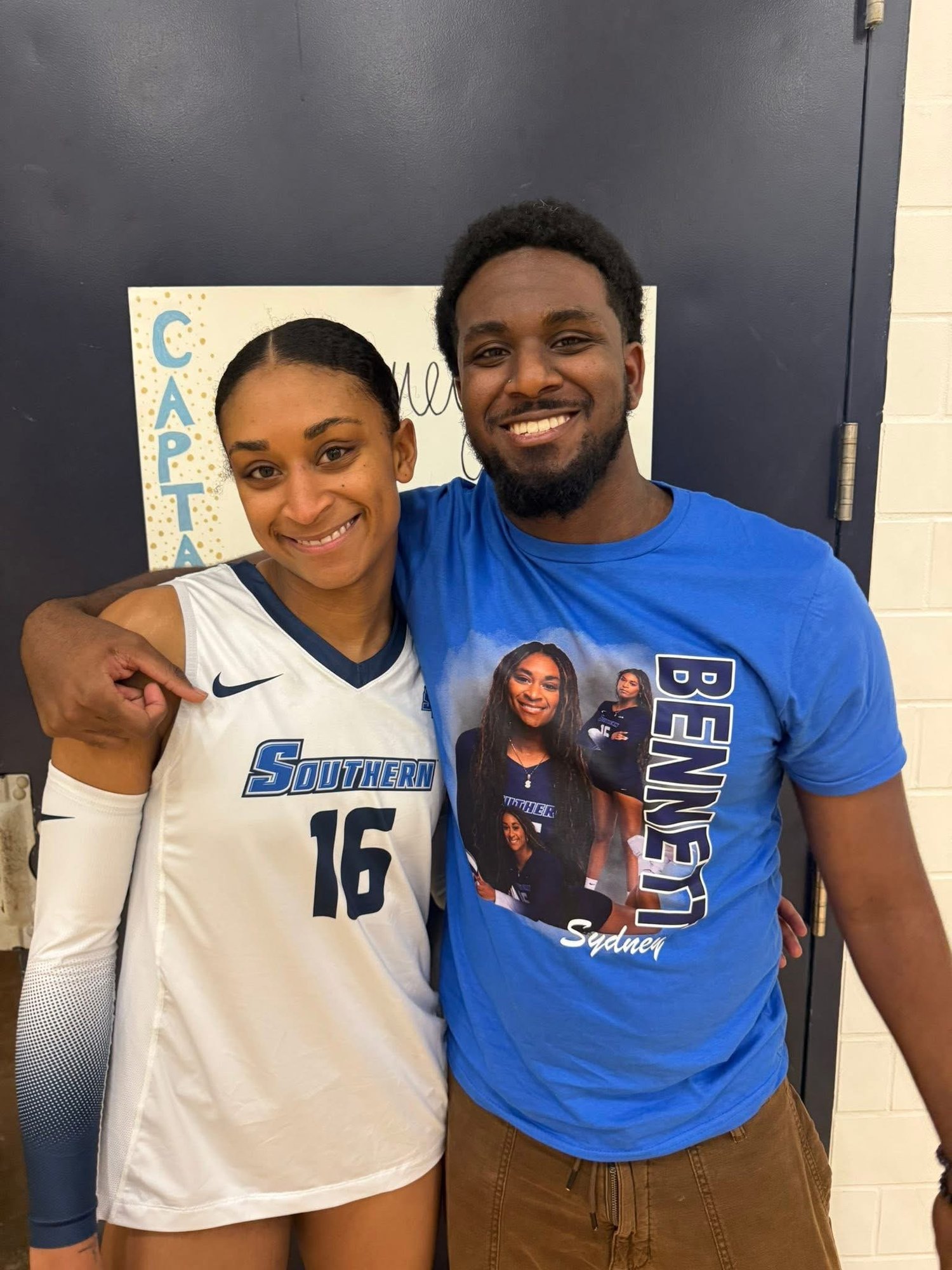 Fan in custom photo tee with volleyball player