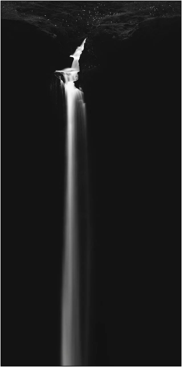 Black and white simplistic image of Mulafossur waterfall, Vagar, Faroe Islands.