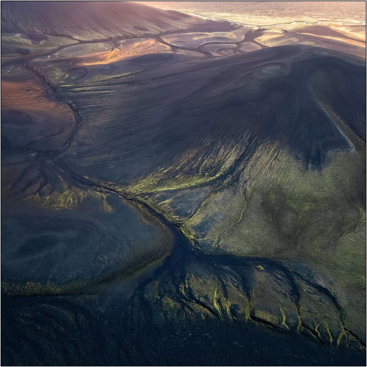Aerial view of landscape in highland Iceland, forming abstract patterns with vein-like textures.