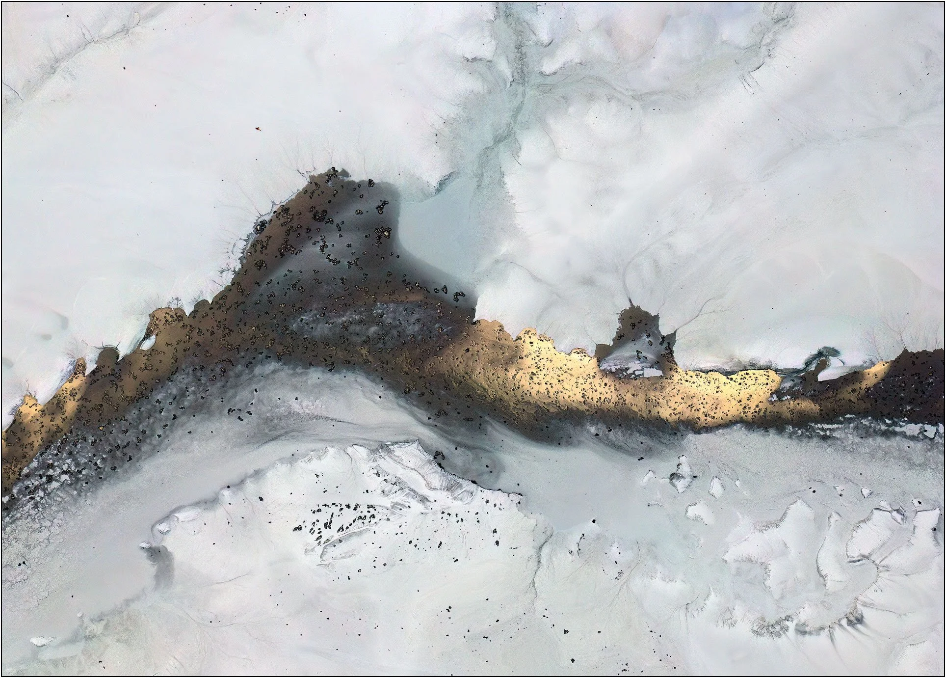 Aerial abstraction with a luminous gold band cutting across a quiet monochrome field