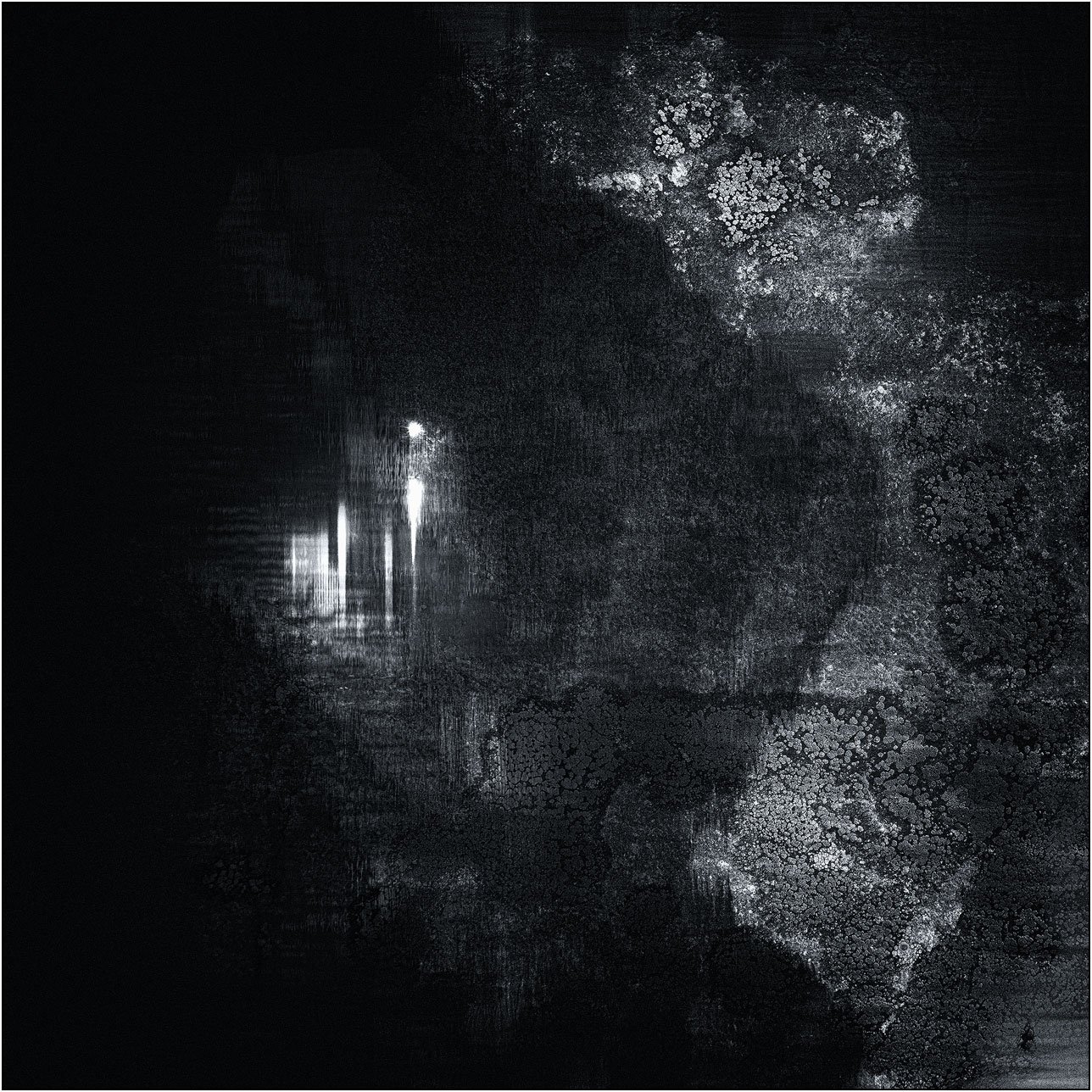 Abstract composition with faint light traces emerging from a dark textured surface