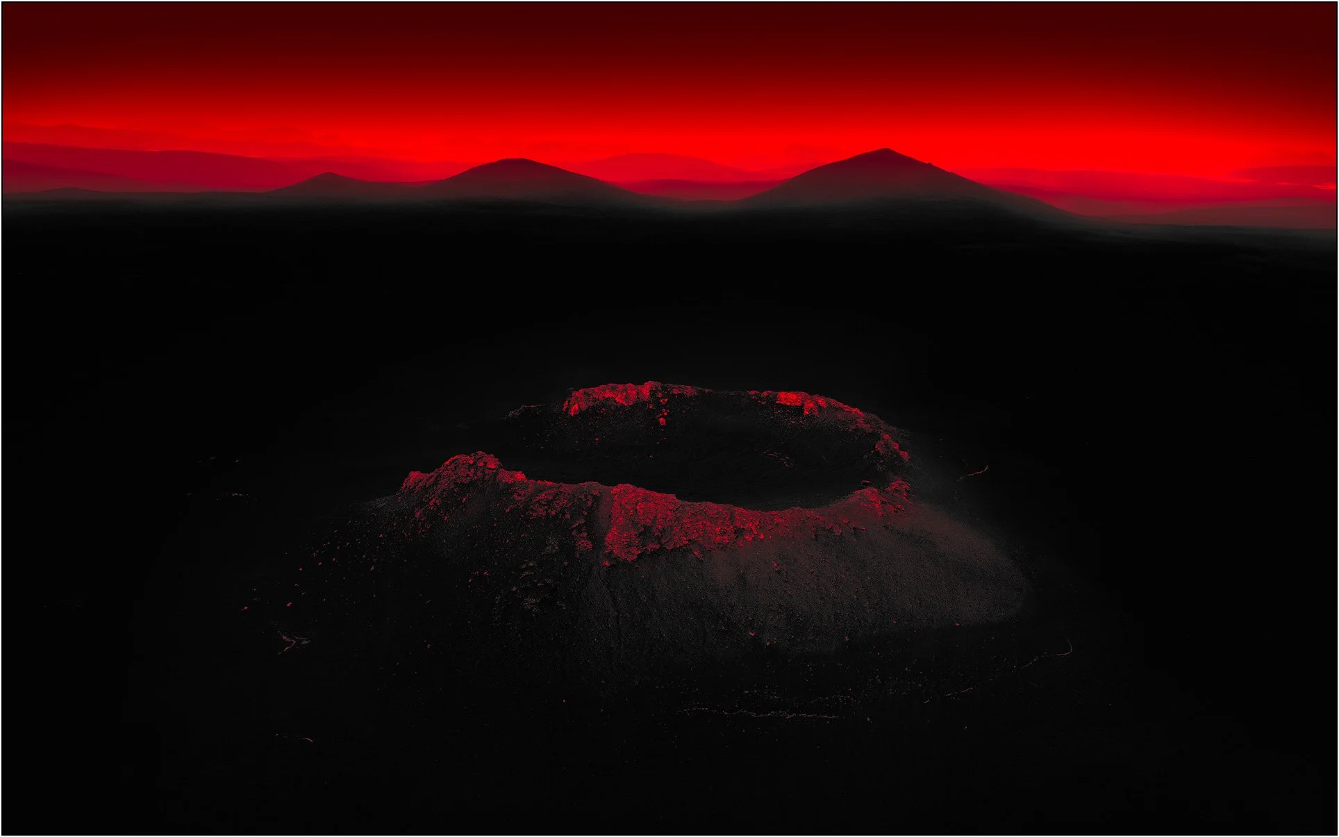 A solitary volcanic crater glowing in deep crimson tones, set against a dark landscape with distant mountain silhouettes.