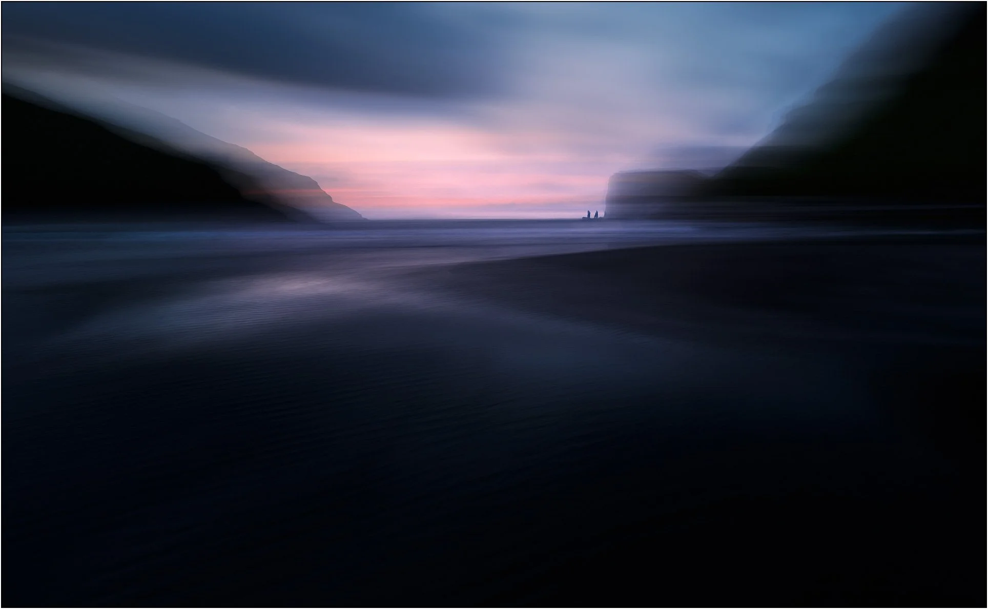 ICM (intentional camera movement) image of Saksun beach at sunset, Faroe Islands, creating blurry and dreaming effect.