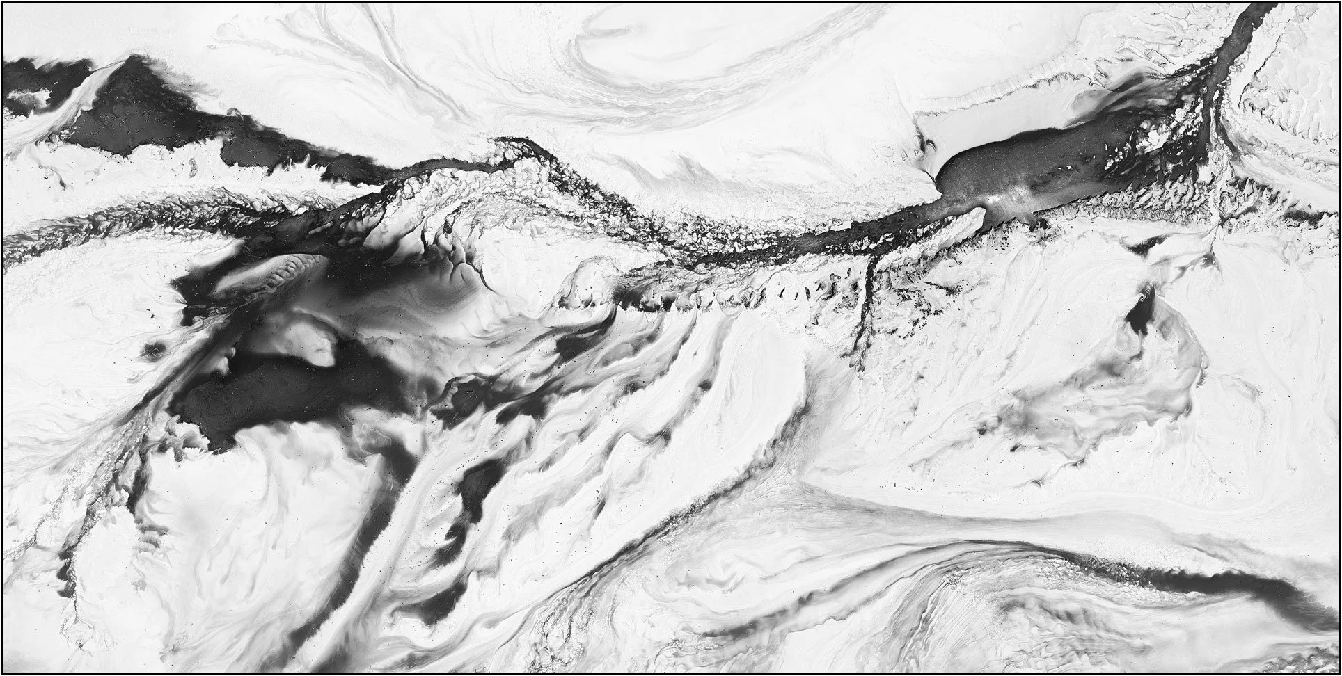 Aerial abstraction of a tailings lake with fluid black and white forms resembling ink in motion.