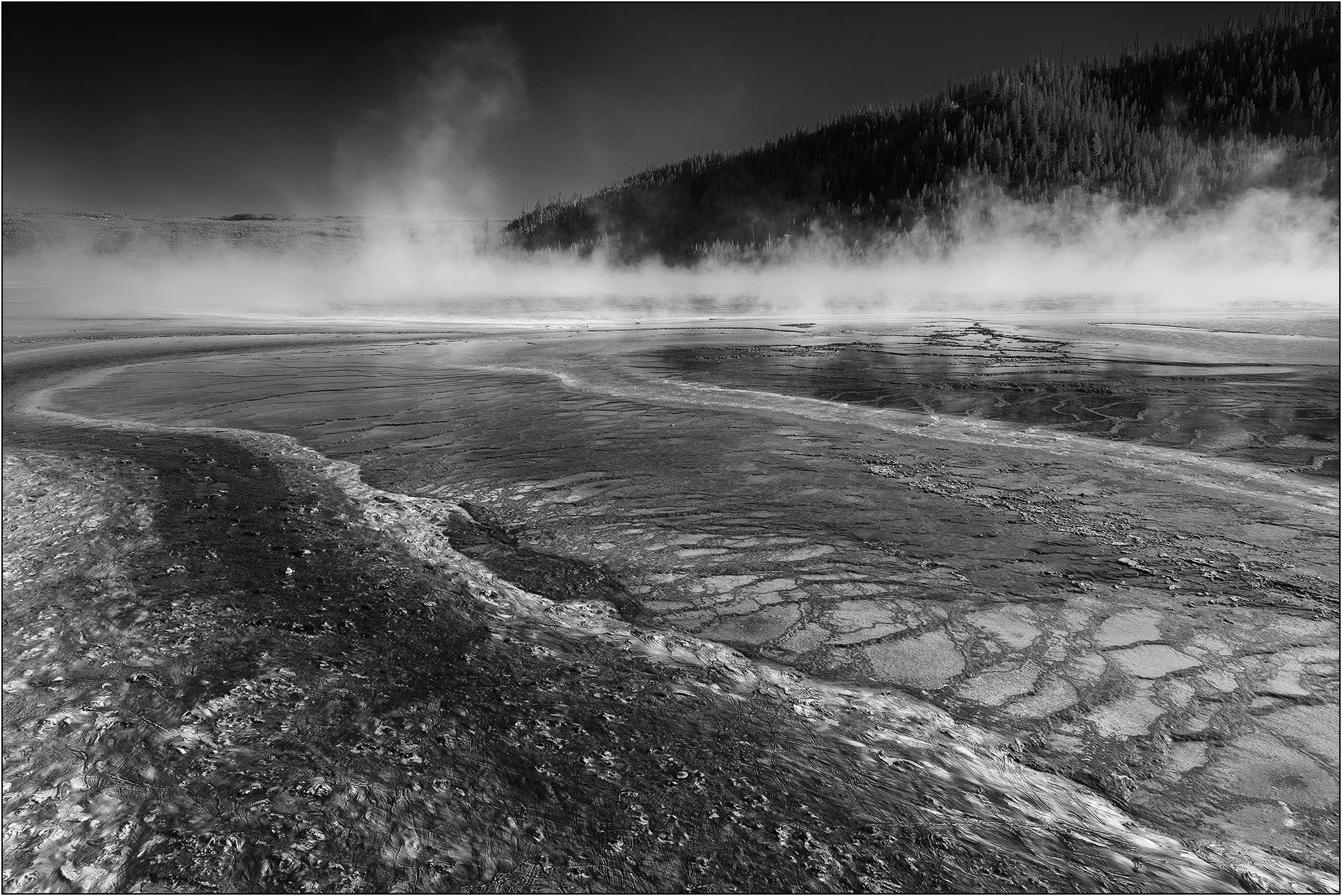 Geothermal runoff patterns in Yellowstone under mist