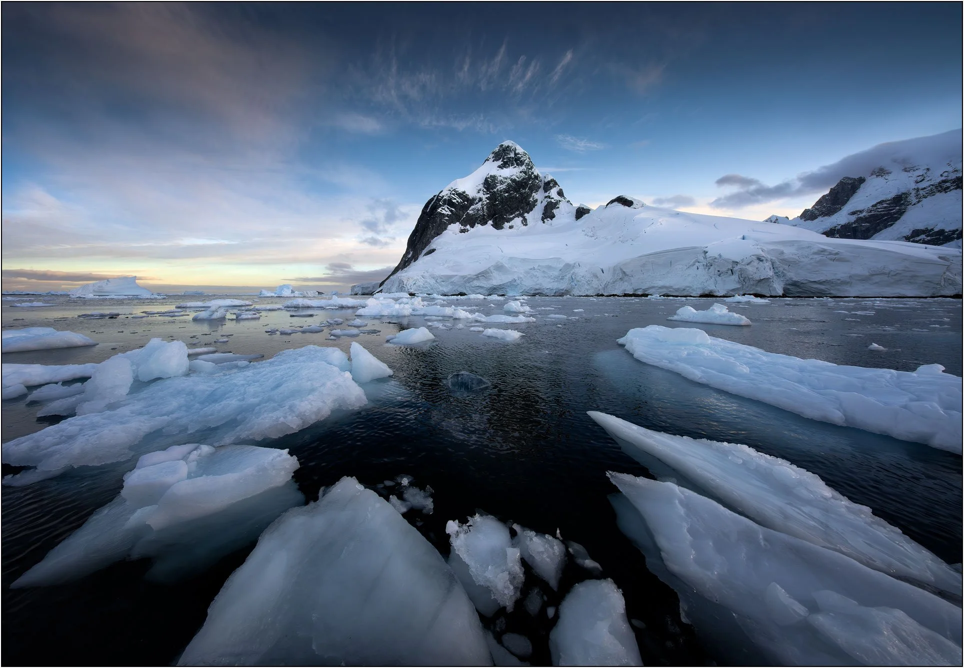 Floating ice surround mountain in Antarctica.