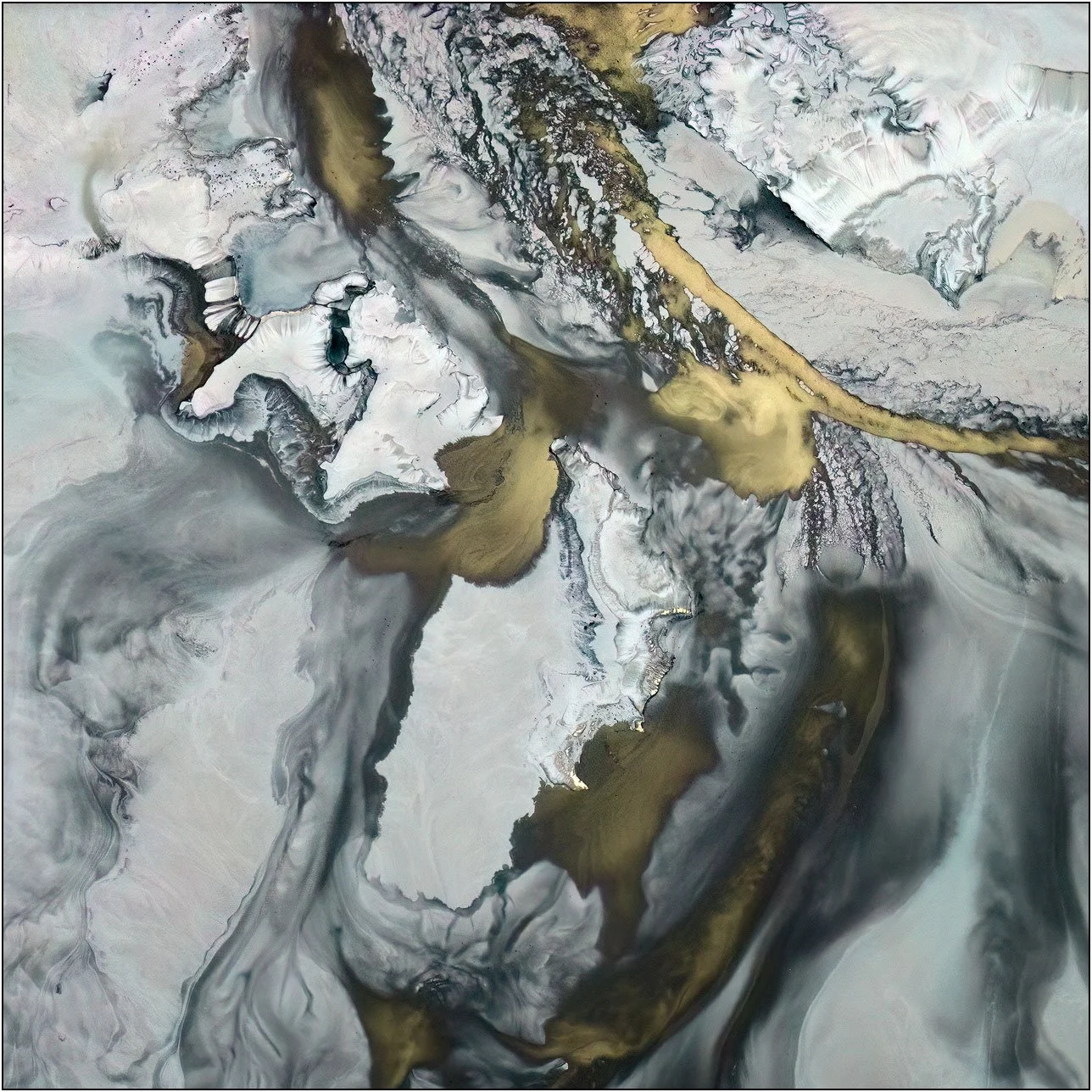 Abstract aerial composition with layered gold and grey tones flowing in organic motion