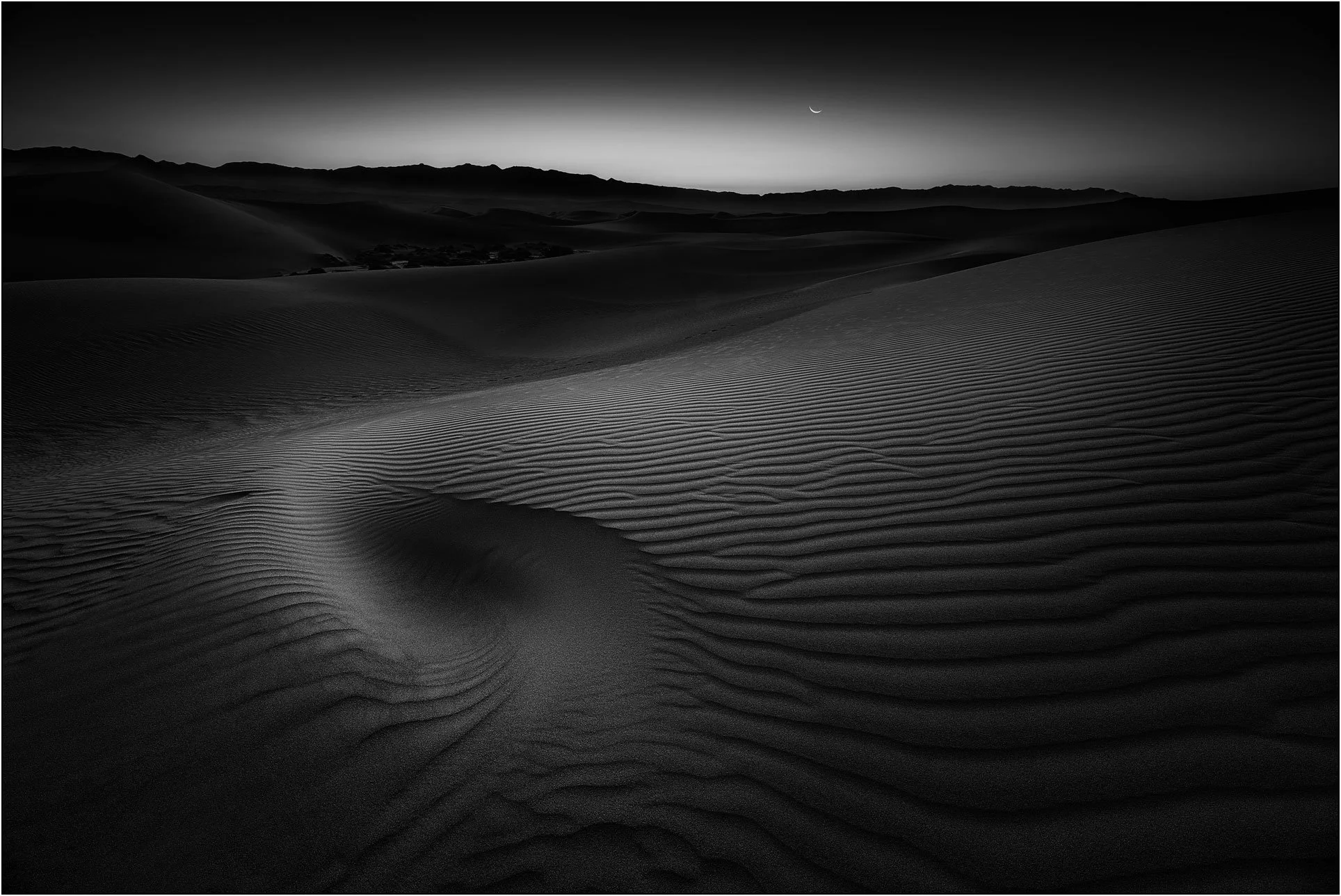 Sand dunes under moonlight in Death Valley