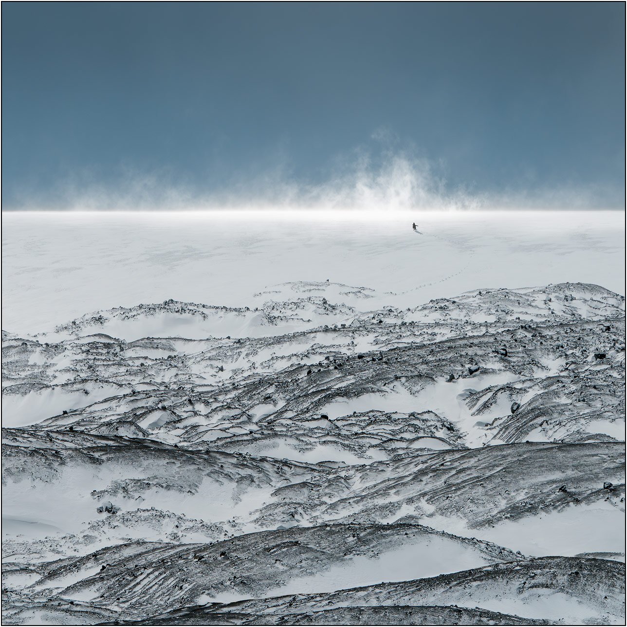 A lone penguin on snow mountains of Antarctica peninsula.