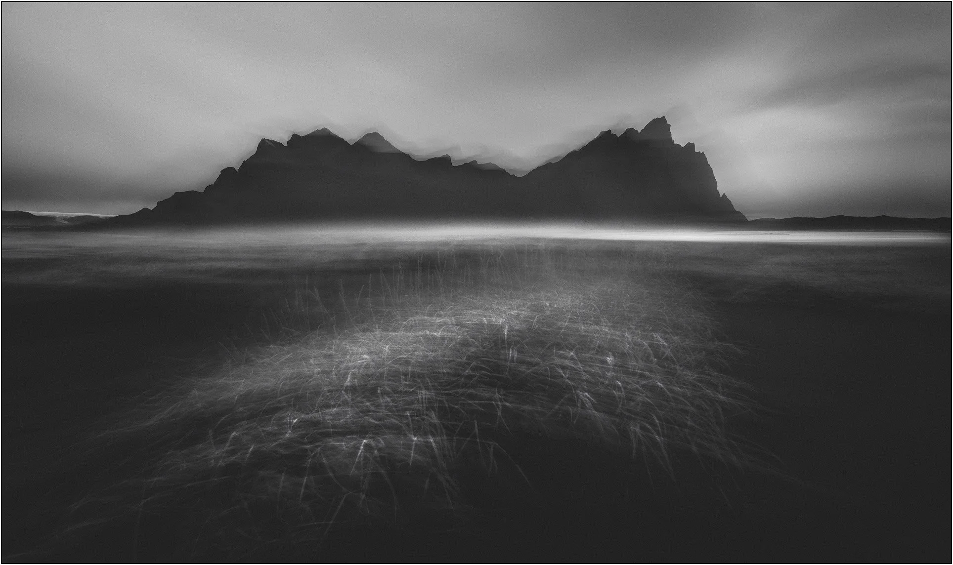 Black and white coastal mountain in Iceland, softly blurred into a dreamlike scene, Vestrahorn, Iceland.
