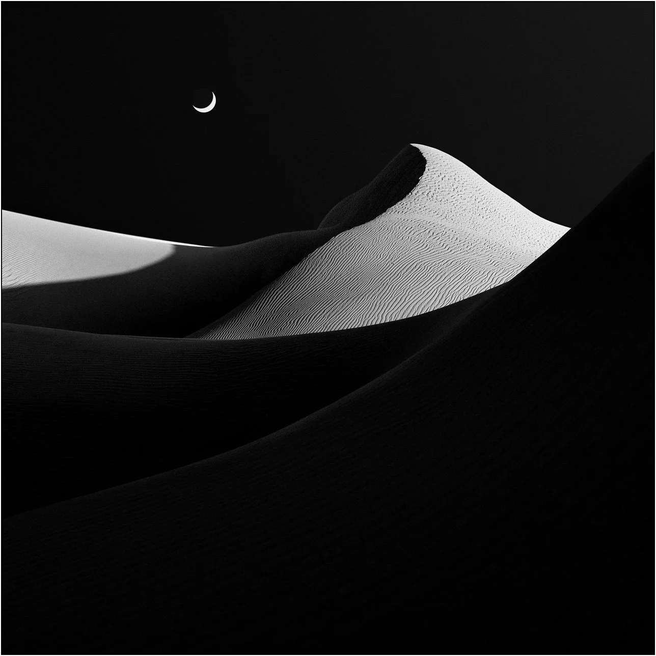 Minimalist sand dunes under a crescent moon in black and white