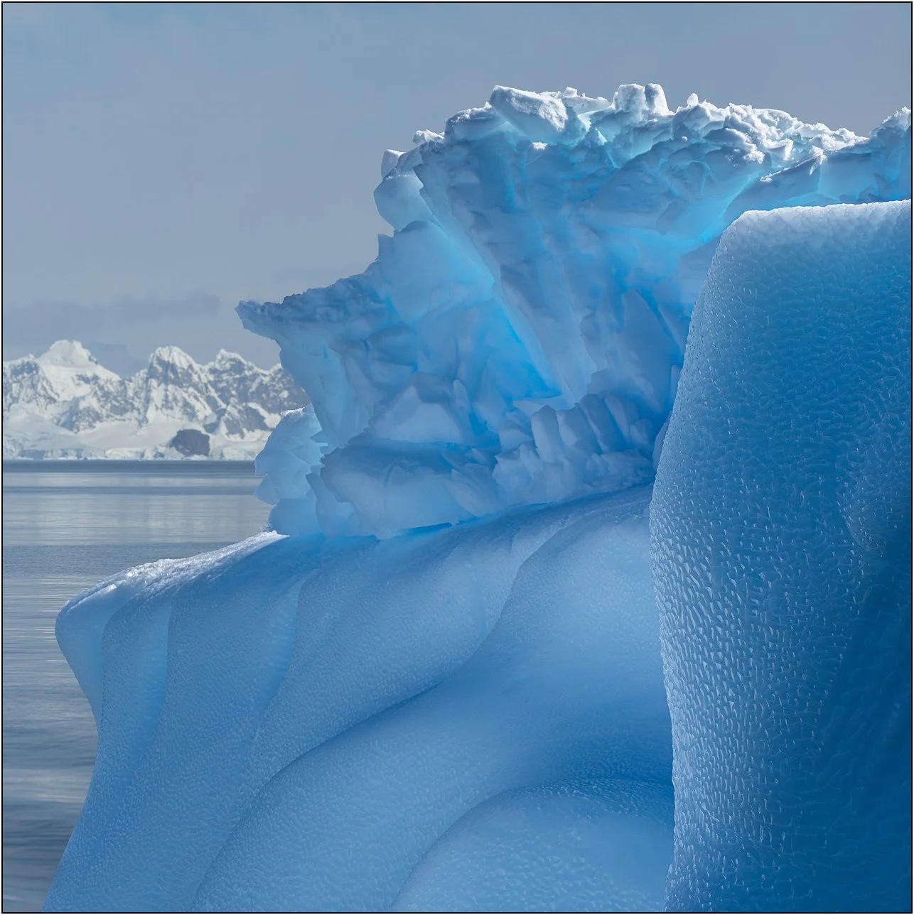 Blue texture details of an iceberg in Antarctica.