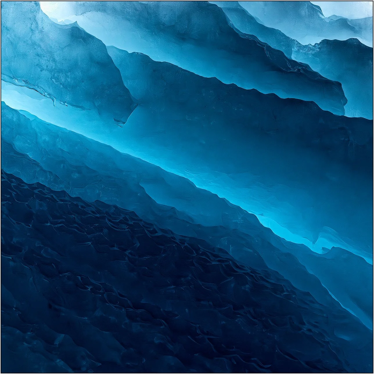 Blue ice texture details of an iceberg floating on the southern ocean in Antarctica.