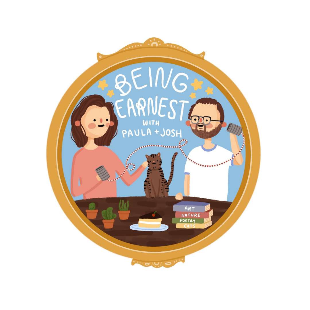 Illustration of a mirror frame with a drawing of a woman and a man holding jump ropes with a cat in between. There are books labeled Art, Nature, Poetry, and Cats, a small cake with a cherry, and potted plants on a table. The text reads "Being Earest with Paula + Josh."