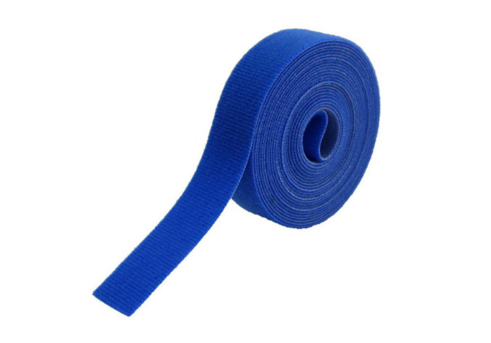 Blue velcro belt rolled up, isolated on white background.
