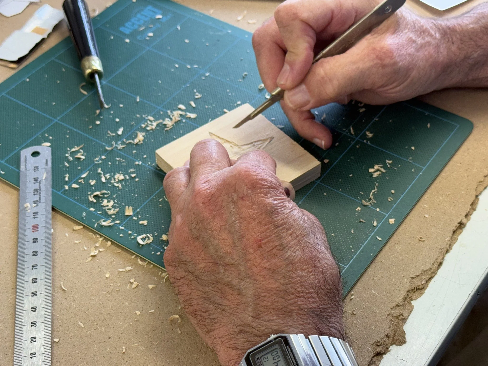 An art student particpating in wooden etching.