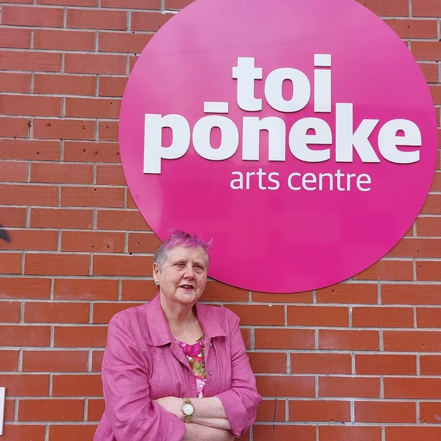 Artist posing at Toi Pōneke