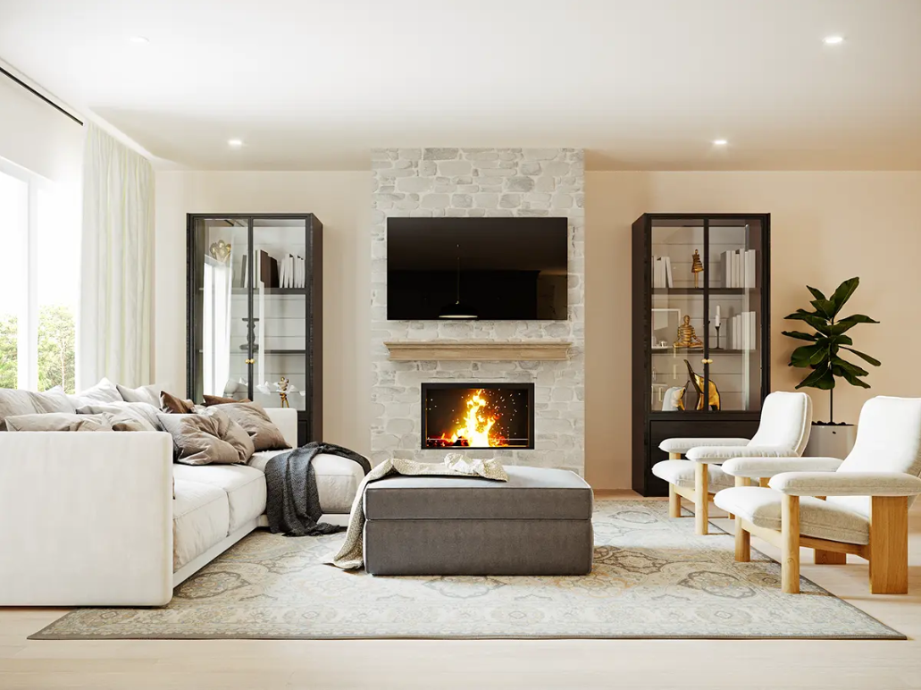 Modern living room with a white sofa filled with pillows, a central ottoman with a blanket, a stone fireplace with a fire, two black glass display cabinets, a wall-mounted TV, a large window with curtains, and a potted plant.